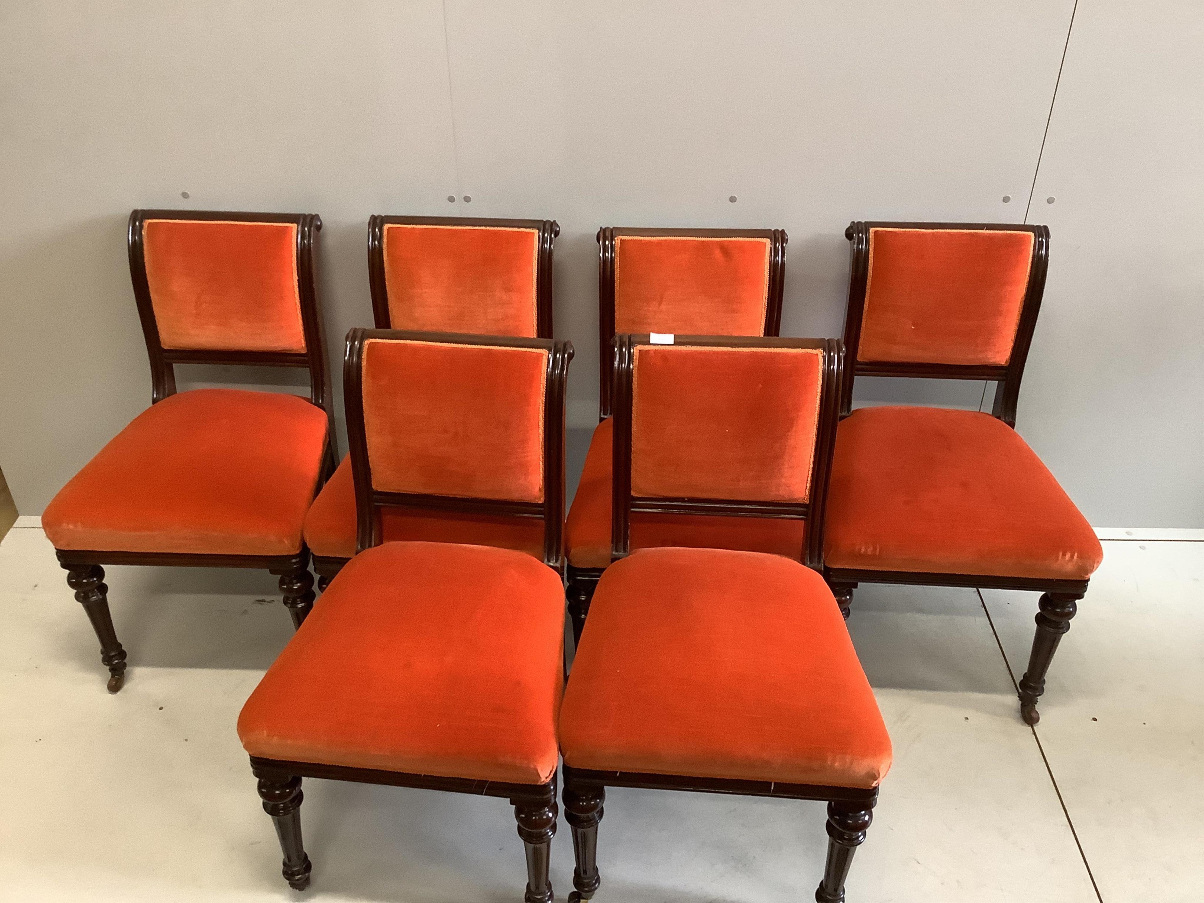 A set of six late Victorian upholstered mahogany dining chairs. Condition - good